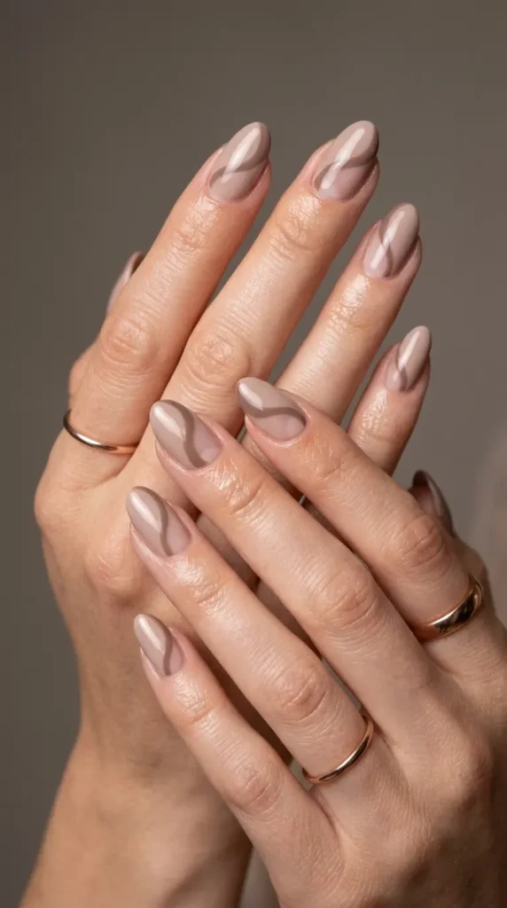 Beige nails with abstract negative space curves