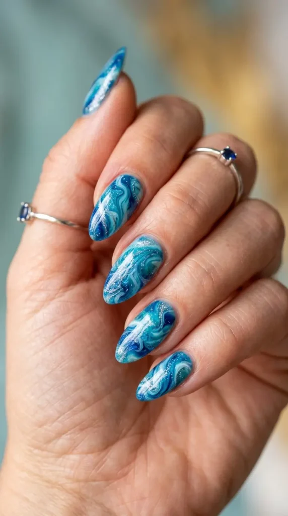 Blue lagoon marble nails with silver shimmer