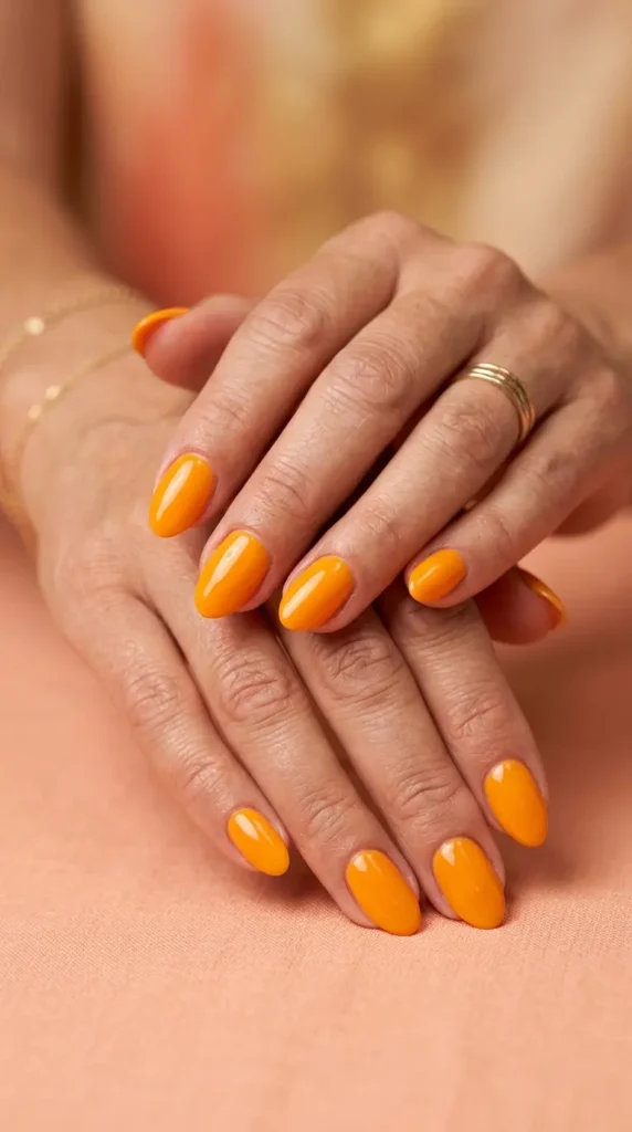 Bright mango orange solid glossy nails