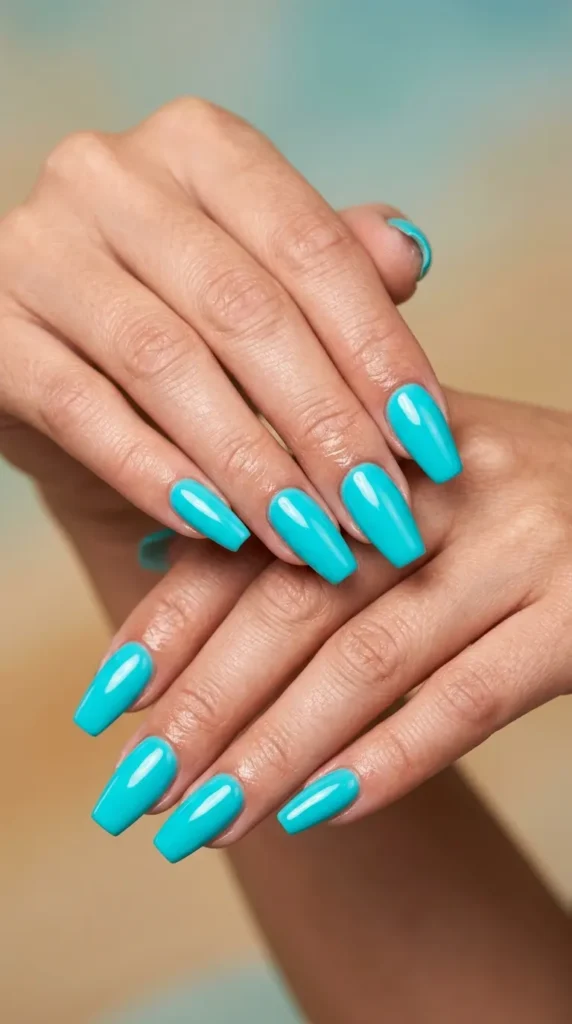 Bright turquoise coffin nails with gloss top