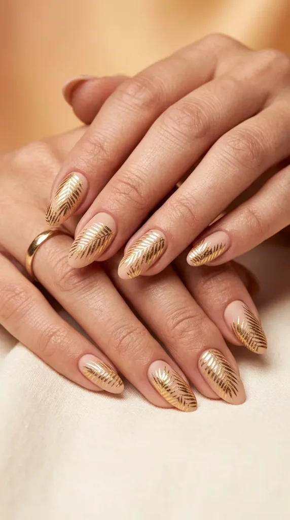 Golden palm leaf foil nails on nude base
