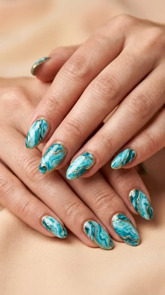 gold-trimmed turquoise marble nails