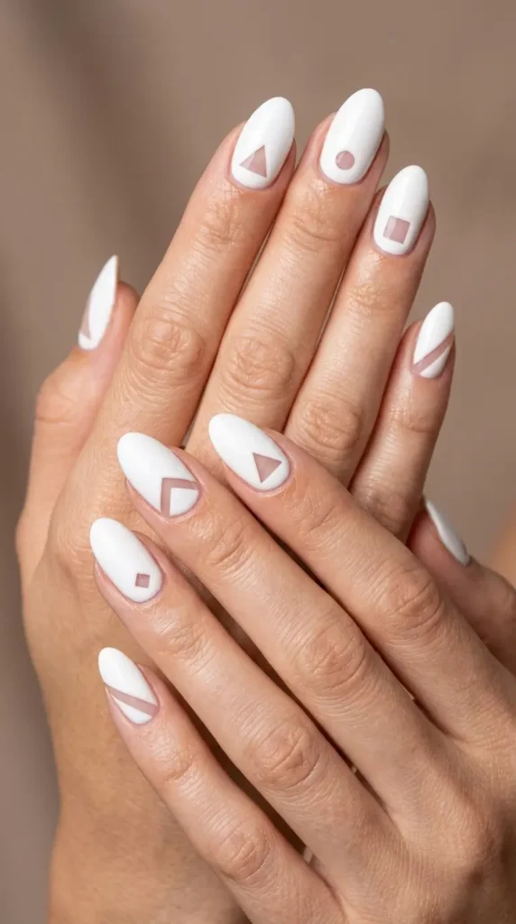 Minimalist white nails with negative space cutouts