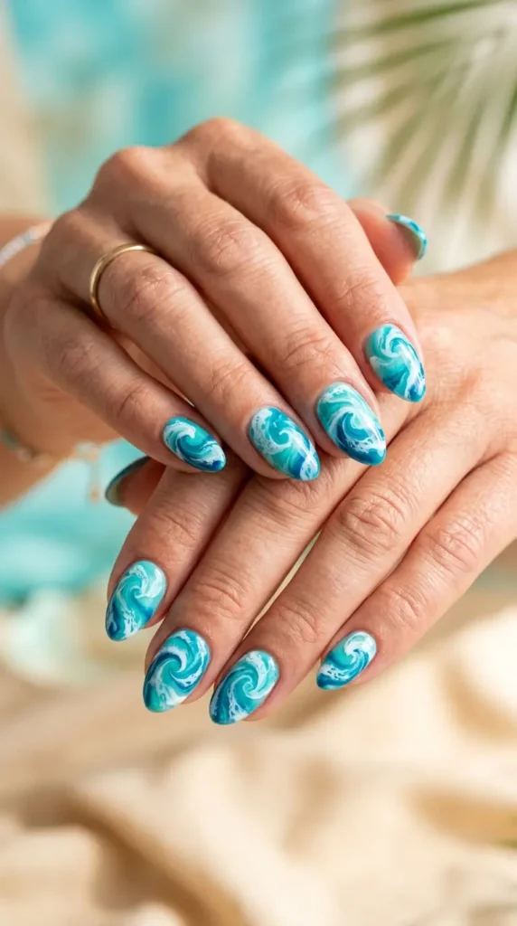 Ocean wave swirl nails in aqua and white