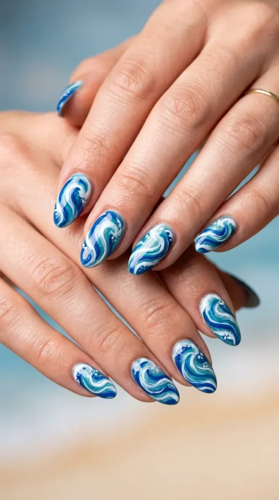 Ocean wave swirl nails in blue and white