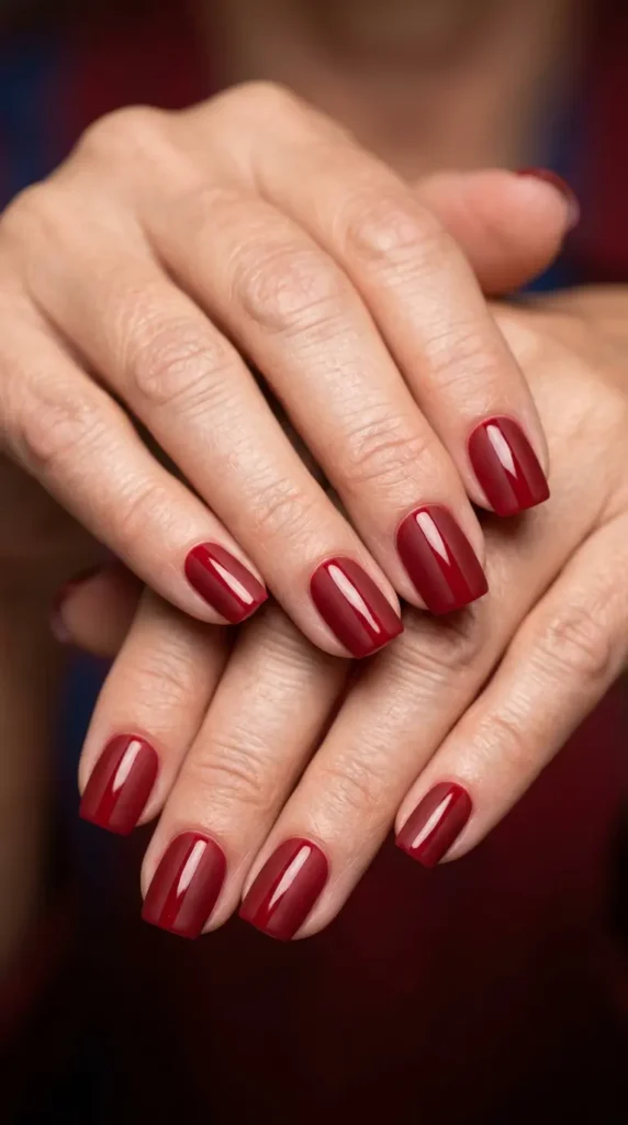 Red matte nails with glossy accent stripe