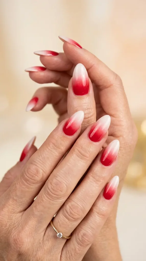 Red ombré nails fading into soft white