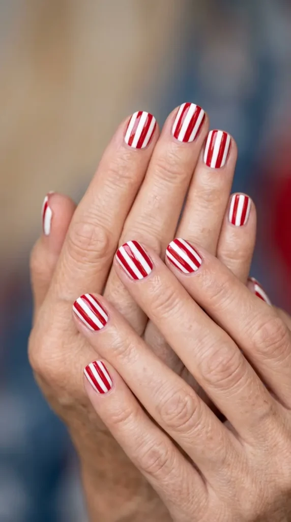 Short nails with alternating red and white stripes