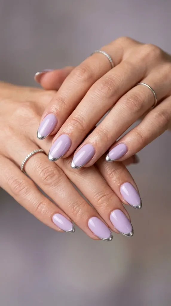 Soft lilac nails with chrome French outline