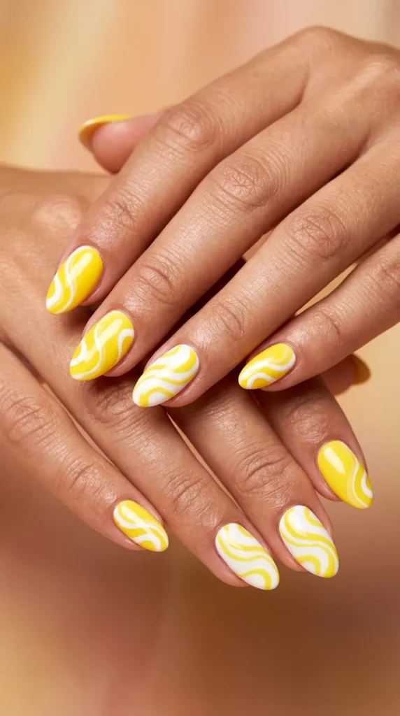 Sunburst yellow + white swirl nails