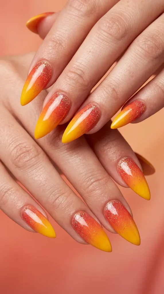 Sunset ombré stiletto nails with glitter fade