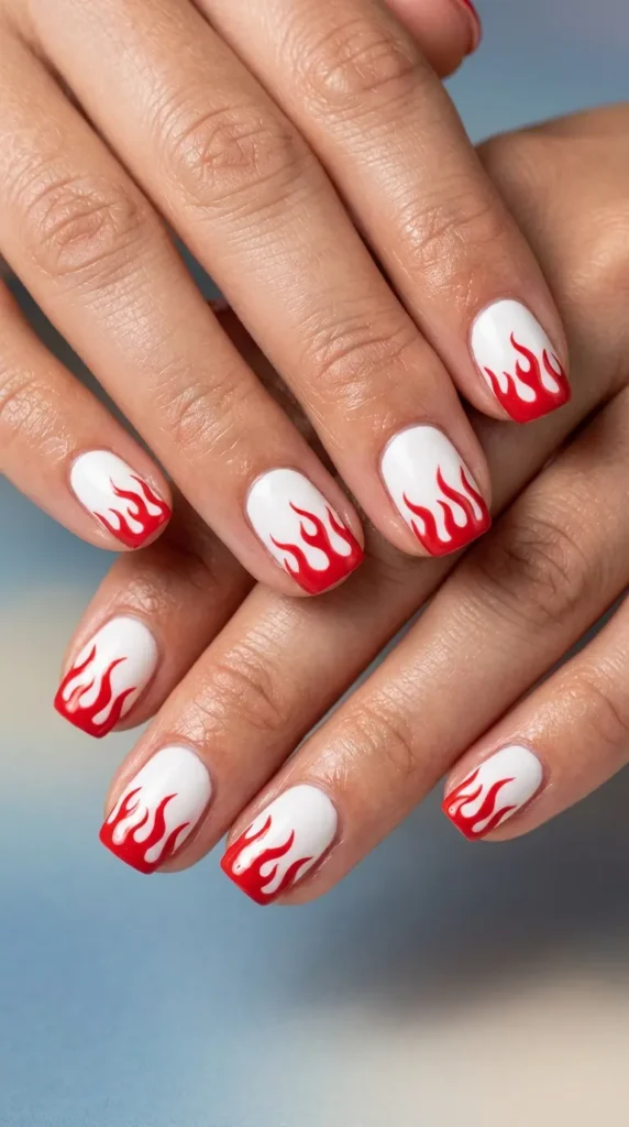 white nails with red flame-style tips
