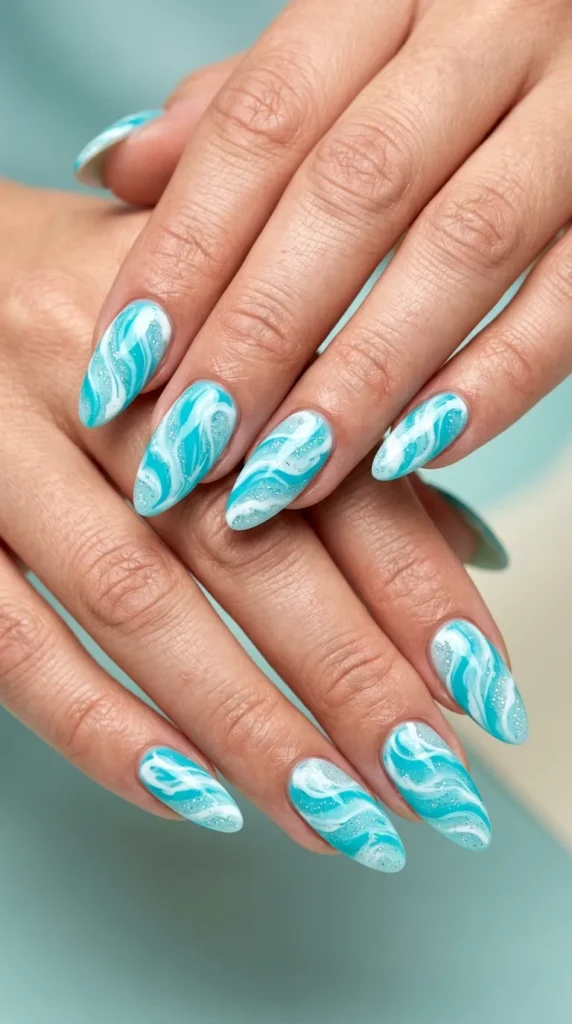 Beach wave marble almond nails in aqua and white