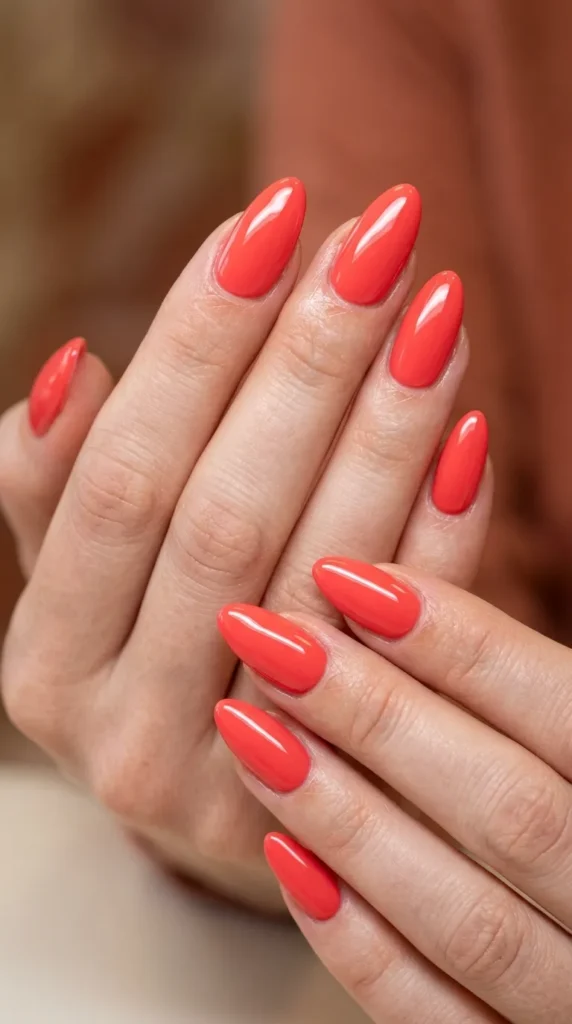 Hot coral solid glossy almond nails (minimal luxury look)