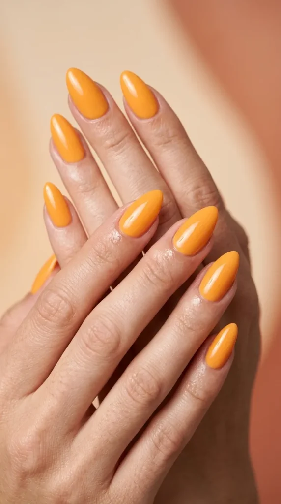 Mango orange glossy almond nails