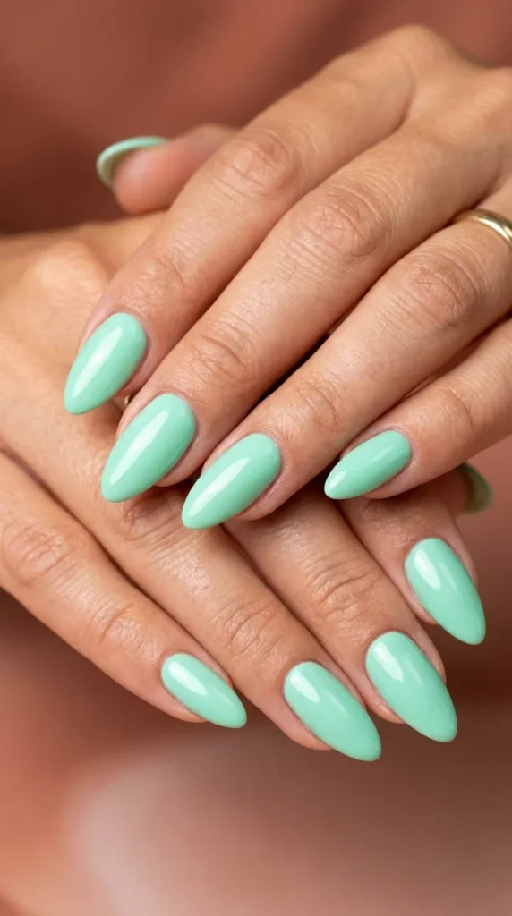 Mint green almond nails with glossy shine