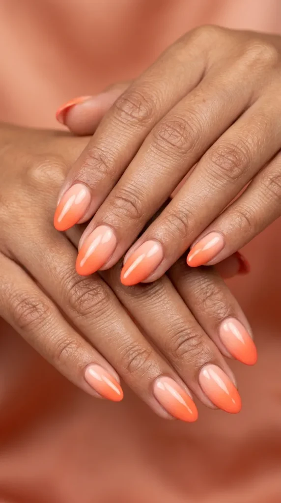 Peach to coral French ombre nails