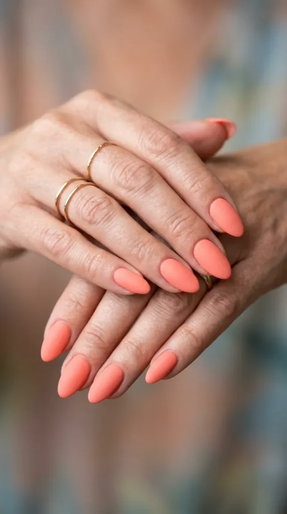 Soft coral matte almond nails