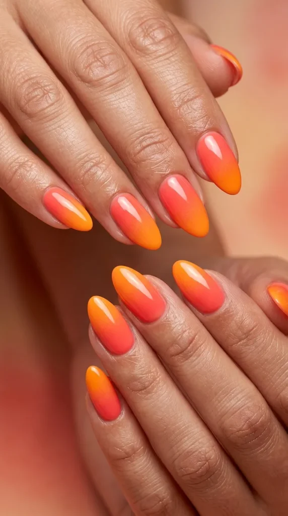 Sunset orange → coral fade ombre nails
