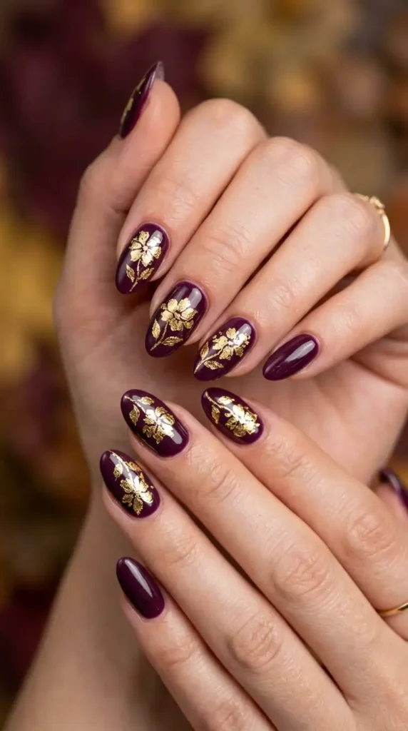 Deep Plum Nails with Gold Leaf Flowers