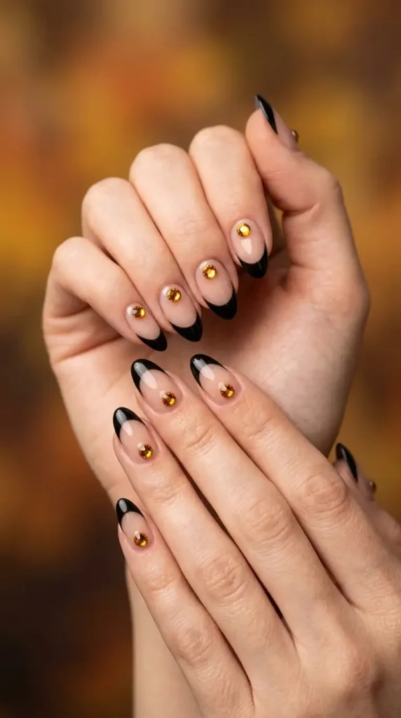Black French Tips Featuring Amber Gem Accents