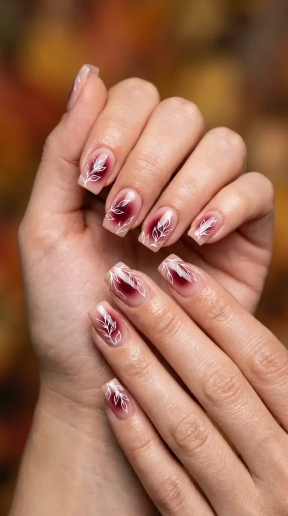 Burgundy Aura Nails with Floral Accents