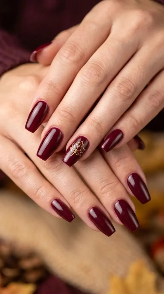 Burgundy Nails with Tiny Maple Leaf Art