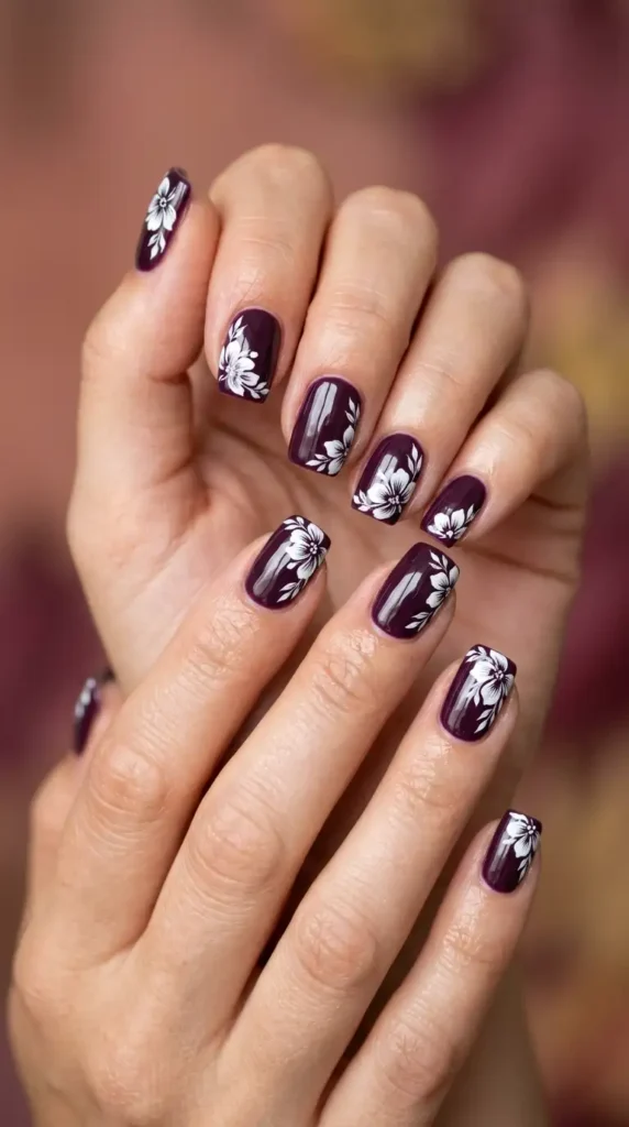 Deep Plum Nails with White Floral Details