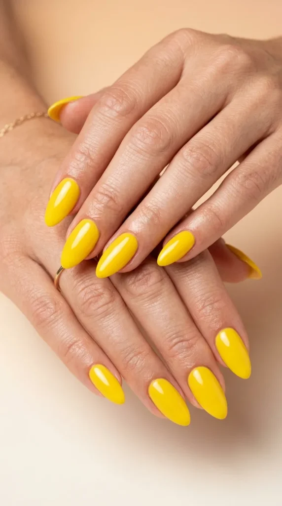 Glossy Yellow Almond Nails
