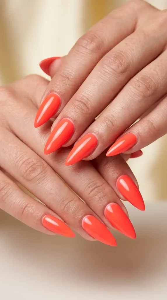 Neon Coral Stiletto Nails