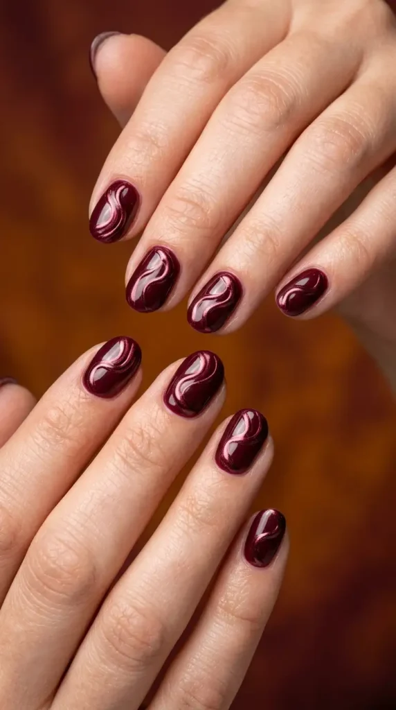 Short Oval Burgundy Chrome Swirl Nails