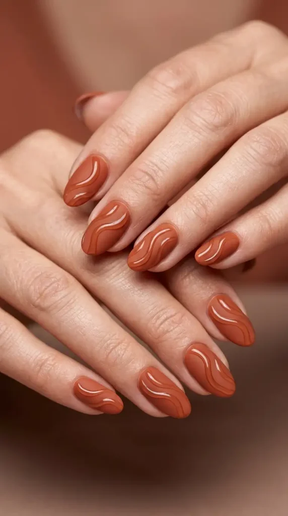 Matte Rust Oval Nails with Glossy Abstract Waves
