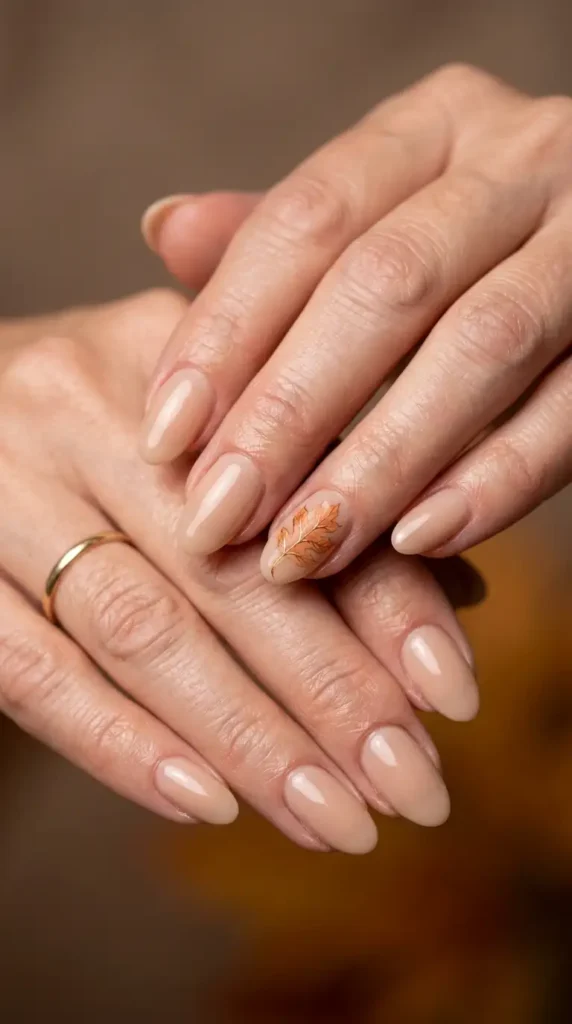 Neutral Oval Nails with Delicate Autumn Leaf Art