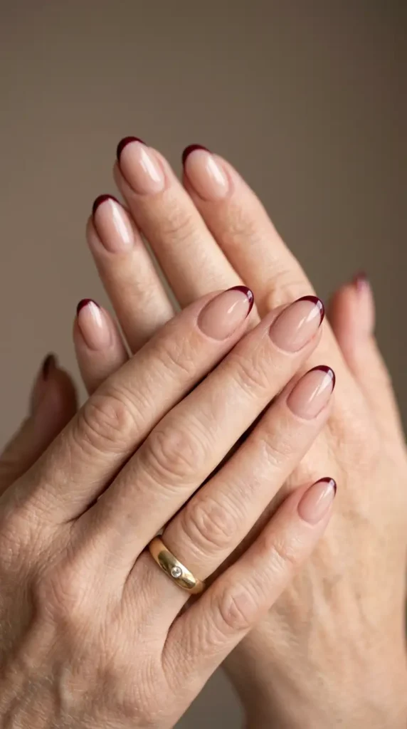 Nude Oval Nails with Thin Burgundy French Tips